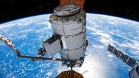 orthrop Grumman's Cygnus space freighter is pictured in the grip of the Canadarm2 robotic arm shortly after it was detached from the Unity module. The orbital complex was soaring 260 miles above the island archipelago of Seychelles in the Indian Ocean at the time of this photograph.