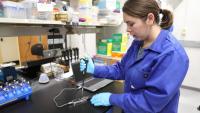 Georgia Tech Ph.D. student Jordan McKaig demonstrates how NASA astronauts onboard the International Space Station will use the MinION sequencing device to identify bacteria genomes. Credit: Georgia Tech