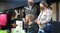 Family learning at demo booth
