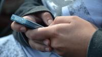 hands holding a cell phone