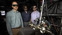 <p>GTRI researchers Creston Herold, Brian Sawyer, and Brian McMahon (l-r) shown with the compact Penning trap apparatus. (Credit: Sean McNeil, GTRI)</p>