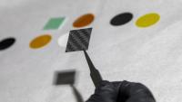 <p>Image shows one of the MISSE-16 materials samples, carbon fiber reinforced polymer (CFRP). (Credit: Sean McNeil, GTRI)</p>