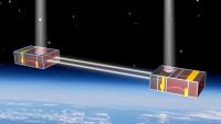 a rendering of two CubeSats in space, beaming light
