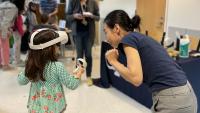 A young participant that is experiencing virtual reality for the first time at Georgia Tech